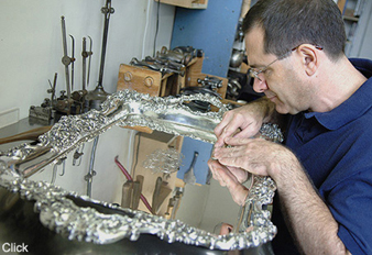 Jeffrey Herman working on a beautifully engraved J.E. Caldwell & Company waiter
